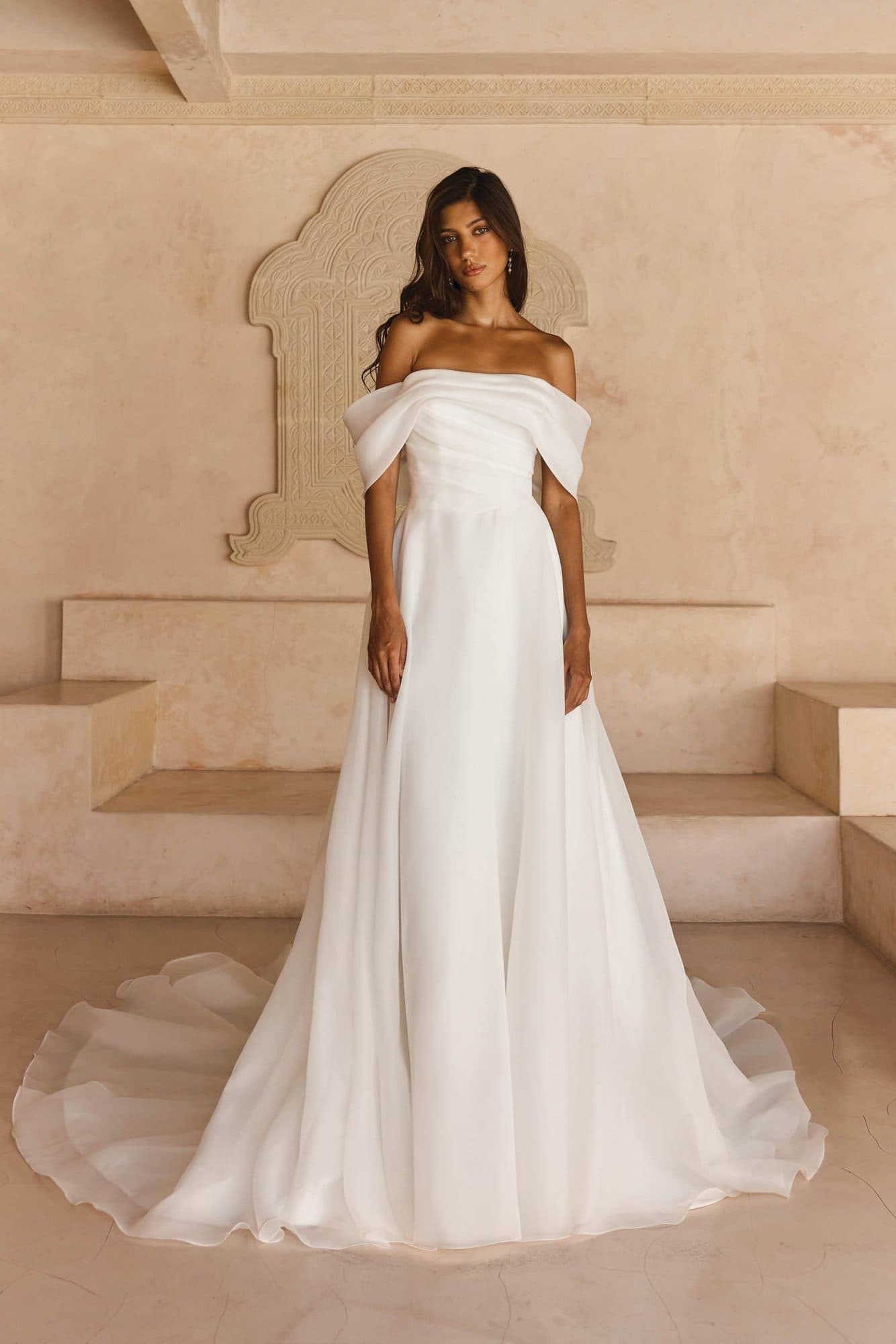 Front of the Madi Lane Lissy gown, an off-the-shoulder organza A-line with a draped bodice.