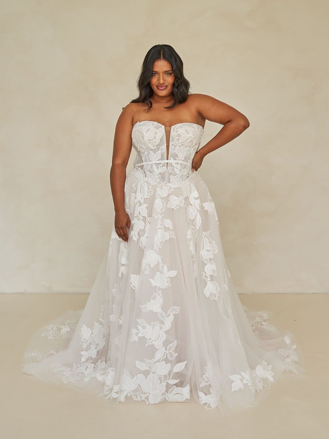 Front of the Madi Lane Walker gown, a strapless ballgown in floral lace.