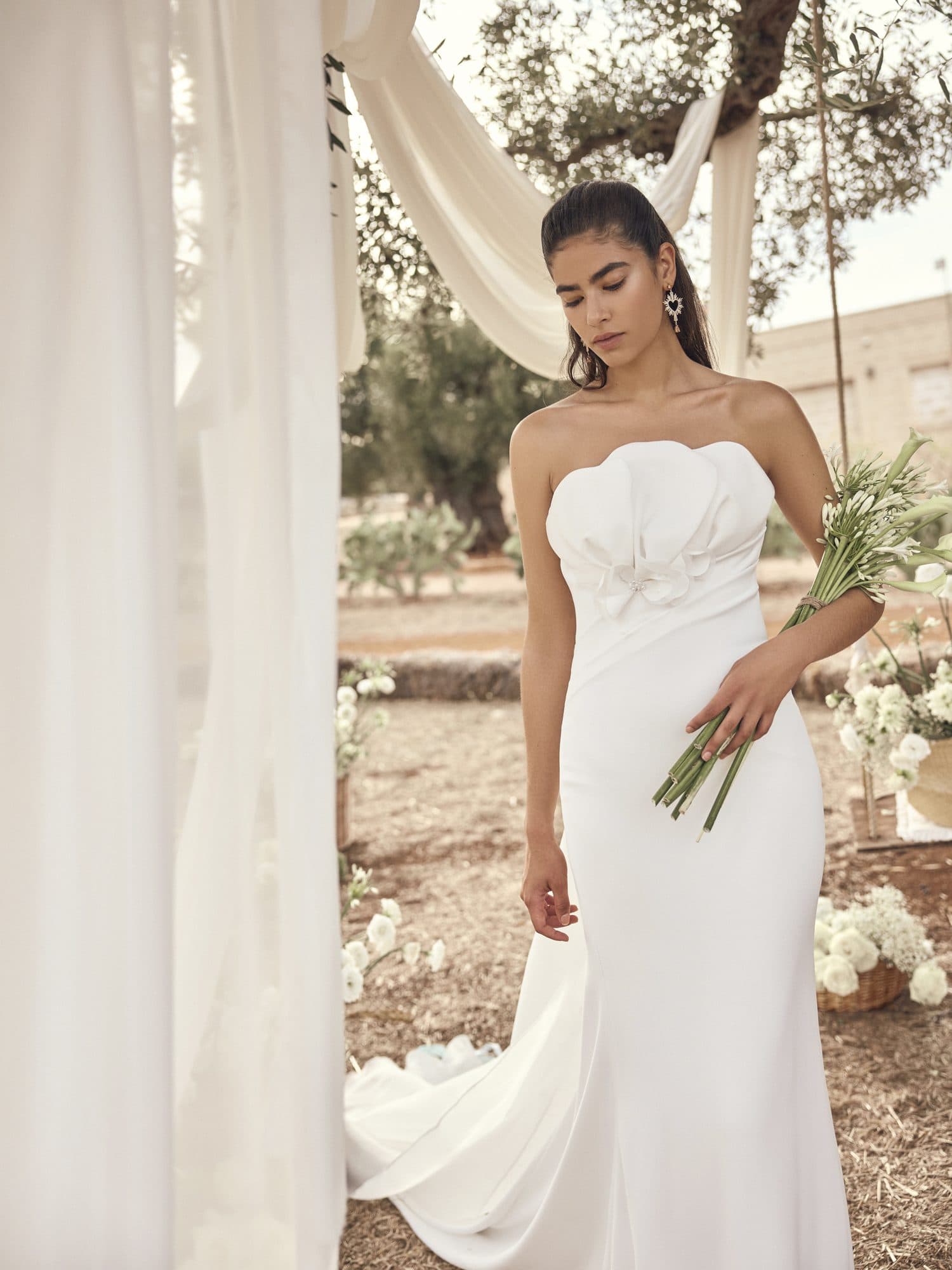 Front of the Modeca Mona gown, a strapless fitted silhouette with a sculpted petal bodice.